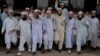 Leaders of a Bangladeshi Islamic group flash victory signs after Bangladesh's top court rejected a 28-year-old petition Monday to remove Islam as the official religion of the Muslim-majority South Asian nation in Dhaka, Bangladesh, March 28, 2016.