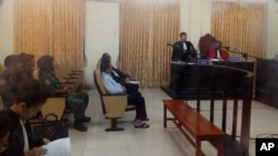 FILE PHOTO - Former opposition leader Kem Sokha, center, sits in a courtroom of the appeals court, in Phnom Penh, Cambodia, Thursday, Feb. 1, 2018. 