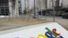 A man walks past the Google company logo outside the Google China headquarters in Beijing (file)