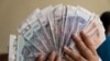 FILE - Different banknotes of Cambodian Khmer Riel are displayed at a local currency exchange store in Phnom Penh, October 13, 2020. (Malis Tum/VOA Khmer)