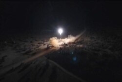 FILE - An image grab from video obtained from the state-run Iran Press news agency allegedly shows rockets launched by Iran against U.S. military bases in Iraq on Jan. 8, 2020.
