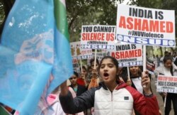 Members of National Students' Union of India (NSUI), the student wing of India's main opposition Congress party, shout slogans during a protest against the attacks on the students of Jawaharlal Nehru Universityon, in New Delhi, Jan 6, 2020.