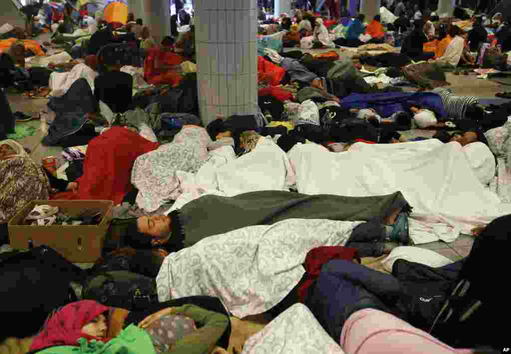 Asylum seekers sleep at Keleti underground railway station in Budapest, Hungary, Sept. 4, 2015.