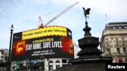英國政府衛生部門4月8日在倫敦市中心展示的對抗新冠病毒疫情的廣告。