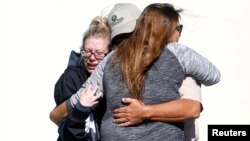 Mourners react outside a reception center for families of victims of a mass shooting in Thousand Oaks, Calif., Nov. 8, 2018.