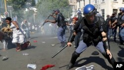 Students run for cover as police fire stun grenades and rubber bullets in an attempt to disperse them, during their protest for free education in Johannesburg, South Africa, Sept. 21, 2016. 