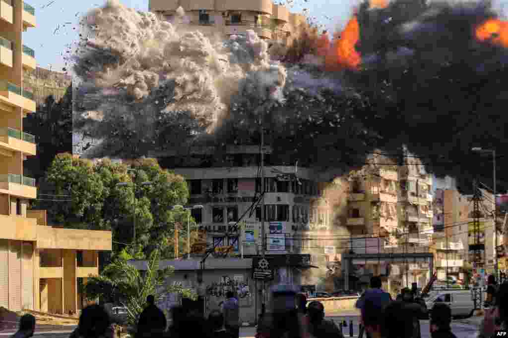 Fire and smoke erupt from a building just after an Israeli airstrike in Beirut's southern Shayah neighborhood, amid the ongoing war between Israel and Hezbollah. (Photo by AFP)