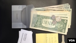 Wallets like these, with cash, a key, a grocery list and business cards, were used to determine honesty. 