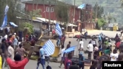 FILE - An image taken from a video shot Oct. 1, 2017, shows protesters waving Ambazonian flags in Bamenda, Cameroon. English-speaking Cameroonians celebrated what they call the 2nd anniversary of their independence day on Oct. 1, 2019.