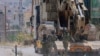 TOPSHOT - Israeli forces storm the Palestinian refugee camp of Jenin in the occupied West Bank on May 21, 2024, in what the military said was a "counterterrorism operation", without providing further details.
