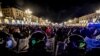 Police face people protesting new government restrictions to curb the spread of the coronavirus, in Turin, Italy, Oct. 26, 2020.