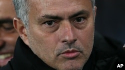Chelsea Manager José Mourinho looks across the pitch before the Champions League Group G soccer match between Chelsea and Sporting Lisbon at Stamford Bridge in London, Wednesday, Dec. 10, 2014. (AP Photo/Tim Ireland)