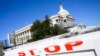 FILE - The U.S. Capitol is seen closed off by a road barrier, during a partial government shutdown in Washington, Dec. 27, 2018. 