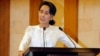 Myanmar State Counsellor Aung San Suu Kyi speaks at a memorial ceremony to mark one month from the killing of Ko Ni, prominent legal adviser to the government, and taxi driver Ne Win, Feb.26, 2017, in Yangon, Myanmar. 