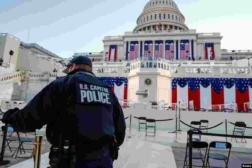 A U.S. Capitol police officer stands on the West Front of the Capitol before Joe Biden's presidential inauguration in Washington, Jan. 20, 2021.