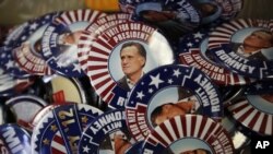 Republican presidential candidate and former Massachusetts Gov. Mitt Romney campaign buttons are displayed ahead of the Republican National Convention in Tampa, Fla., on Aug. 26, 2012.