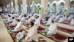 Muslim pilgrims pray inside the Namira Mosque in Arafat during the annual hajj pilgrimage near the holy city of Mecca, Saudi Arabia, July 30, 2020.