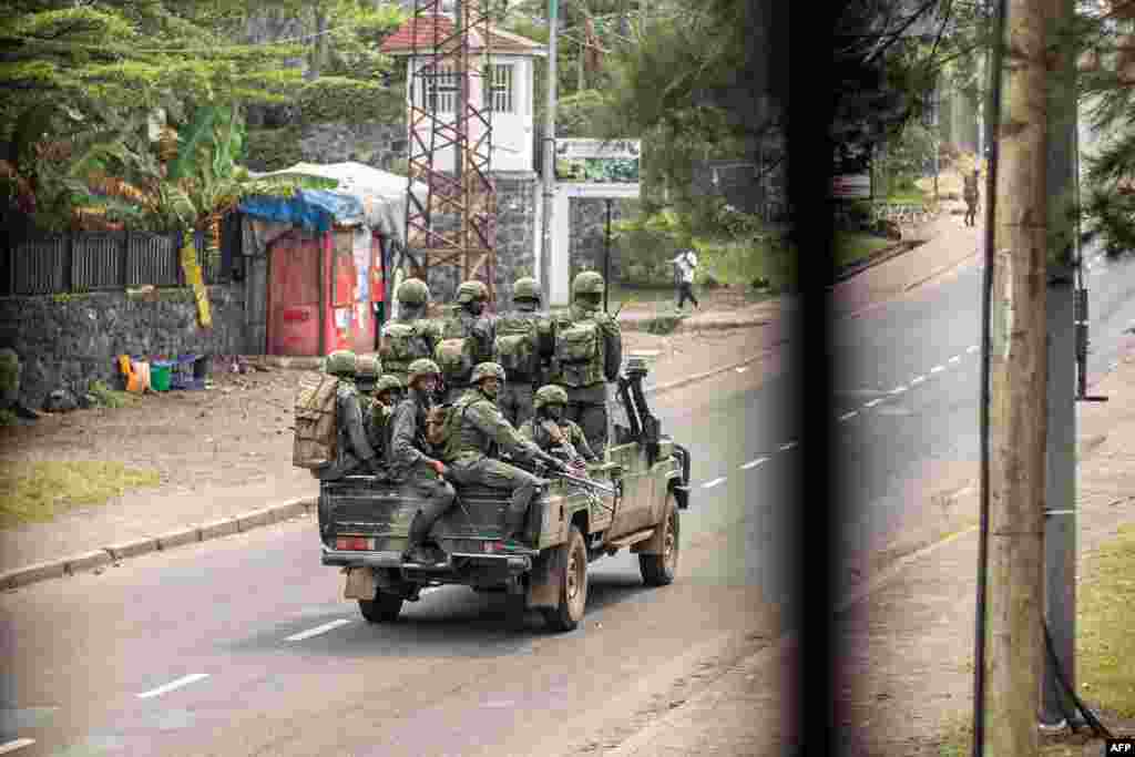 Armed men drive through a street in Goma, Democratic Republic of Congo, Jan. 28, 2025. Gunshots rang out through parts of the besieged city of Goma as Congolese soldiers clashed with militia fighters backed by Rwandan troops.