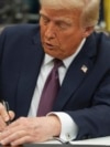 FILE - U.S. President Donald Trump signs an executive order on birthright citizenship in the Oval Office of the White House in Washington on Jan. 20, 2025.