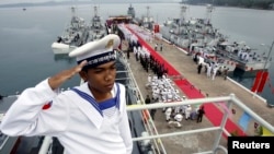 FILE PHOTO - A Cambodian Navy sailor salutes on a Chinese naval patrol boat during a handover ceremony at a Cambodian naval base at Ream in Sihanoukville province, southwest of Phnom Penh, November 7, 2007. (REUTERS/Chor Sokunthea)