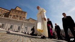 FILE - Pope Francis is seen arriving in St. Peter's Square at the Vatican May 13, 2015.
