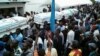 Mourners carry coffins containing the bodies of protesters killed in September rallies organized by the Union for Democracy and Social Progress (UDPS), during a funeral service at UDPS headquarters in Limete, Kinshasa, DRC, Nov. 1, 2016.