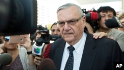 FILE - Former Sheriff Joe Arpaio leaves the federal courthouse, July 6, 2017, in Phoenix, Arizona.