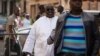 ARCHIVES - Papa Massata Diack, au centre, fils de l'ancien président de l'IAAF Lamine Diack arrive au commissariat central de Dakar, au Sénégal, lundi 17 février 2016. 