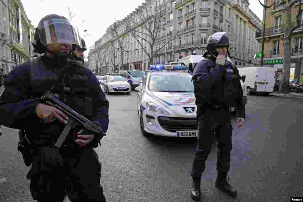French riot police block the avenue Kleber after an alert in Paris, Jan. 9, 2015.