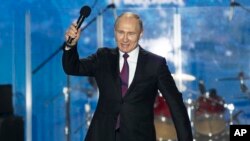 Президент Путін кульмінацію своєї виборчої кампанії влаштував у Криму. 14 березня 2018 р.