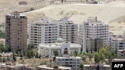 New buildings are seen in Damascus, Syria, in this file photo. Iranians are investing in and providing labor for some of the construction in the war-torn country. AFP PHOTO/ LOUAI BESHARA 