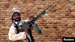 FILE - Boko Haram leader Abubakar Shekau holds a weapon at an unknown location in Nigeria in this still image taken from an undated video obtained Jan. 15, 2018.