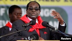 FILE: Zimbabwe President Robert Mugabe addresses people gathered for his 91st birthday celebration in Victoria Falls, Feb. 28, 2015. 