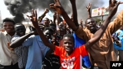 Sudanese people protest against a military coup that overthrew the transition to civilian rule, on October 25, 2021, in the capital Khartoum's twin city of Omdurman.