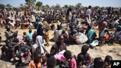 FILE - Some of more than 30,000 people who flocked into Leer town, South Sudan, to receive food from the International Committee of the Red Cross, Dec. 15, 2015, which marks the two-year anniversary of South Sudan's civil war. 