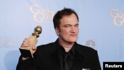 Director Quentin Tarantino holds the award for Best Screenplay - Motion Picture for "Django Unchained" backstage at the 70th annual Golden Globe Awards in Beverly Hills, California, January 13, 2013.