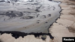 A Shell tailings pond at their tar sands operations near Fort McMurray, Alberta, Sept. 17, 2014. 