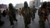 Masked Palestinian members of the Ezz Al-Din Al Qassam brigade, the military wing of Hamas in Gaza City, Nov. 14, 2013.