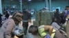 Volunteers sorting items donated for Haiti at a Washington warehouse