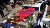 FILE - A heart is pictured on a police car that makes up part of a makeshift memorial at police headquarters following the multiple police shooting in Dallas, Texas, July 8, 2016. 