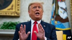FILE - President Donald Trump speaks during a meeting in the Oval Office of the White House, Feb. 12, 2020, in Washington. 