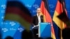 German far-right outlines radical program as protesters rally 
