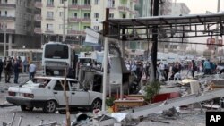 Police search an area after a bomb attack in Mardin, Turkey, Aug 10, 2016.