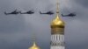 Russian military helicopters fly over the Ivan the Great bell-tower and Kremlin during a rehearsal in Moscow, Russia, May 5, 2016.