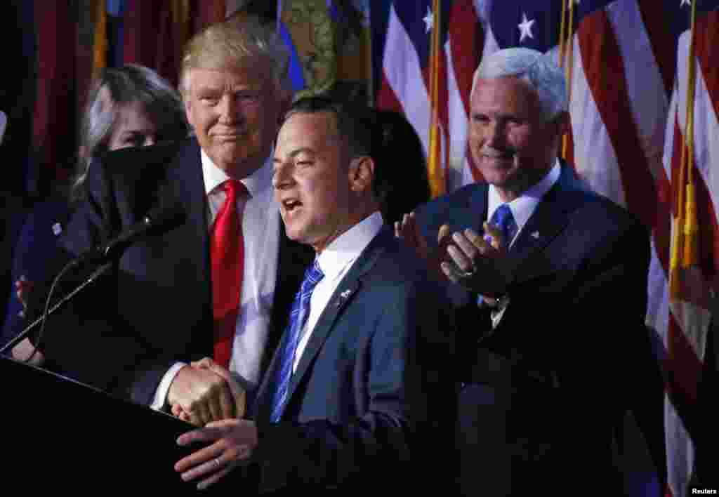 U.S. President elect Donald Trump shakes hands with Republican National Committee Chairman Reince Priebus (C) as Vice President-elect Mike Pence (R) looks onat election night rally in Manhattan, New York, Nov. 9, 2016.