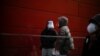 'Please Protect Yourself': China Wrestles With COVID Surge