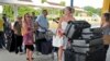 FILE - British tourists queue with their luggage to leave by charter flight from the international airport in Mombasa, Kenya.
