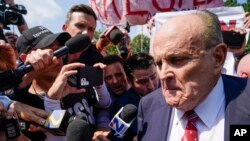 FILE - Rudy Giuliani speaks in Atlanta, Georgia, on Aug. 23, 2023. A federal judge on Aug. 30, 2023, entered a default judgment against Giuliani in a defamation lawsuit brought by two election workers in Georgia.