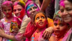 Indians smeared in color participate in Holi festival celebrations in Gauhati, India, Monday, March 29, 2021. (AP Photo/Anupam Nath)