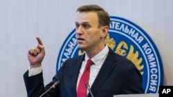 Russian opposition leader Alexei Navalny speaks at the Russia's Central Election commission in Moscow, Dec. 25, 2017. Russian election officials have formally barred Russian opposition leader Alexei Navalny from running for president. (Evgeny Feldman/Navalny Campaign via AP)